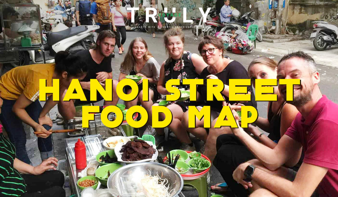 Truly Voyage blog post graphic titled "Hanoi Street Food Map" showing a group of travelers sitting on low plastic stools eating local dishes at an outdoor street food stall in Hanoi.
