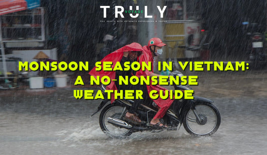 Truly Voyage blog post graphic titled "MONSOON SEASON IN VIETNAM: A NO-NONSENSE WEATHER GUIDE" showing two people riding a motorbike through heavy rain while wearing red ponchos.