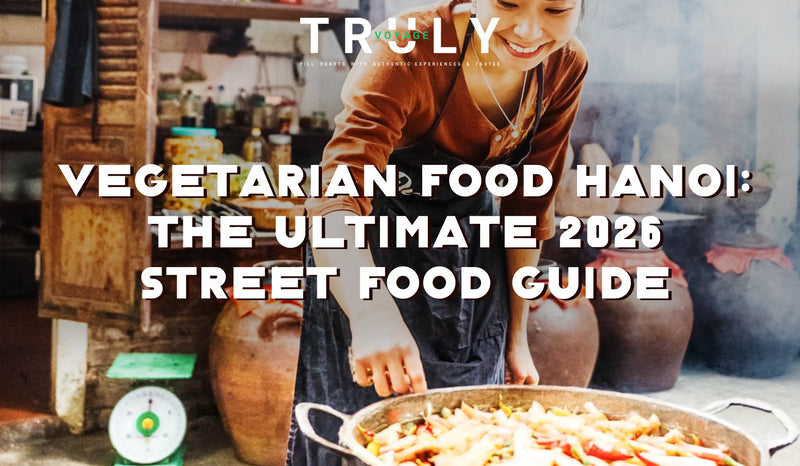 Truly Voyage blog post graphic titled "Vegetarian Food Hanoi: The Ultimate 2026 Street Food Guide" showing a smiling local vendor cooking at a street stall with large clay pots in the background.